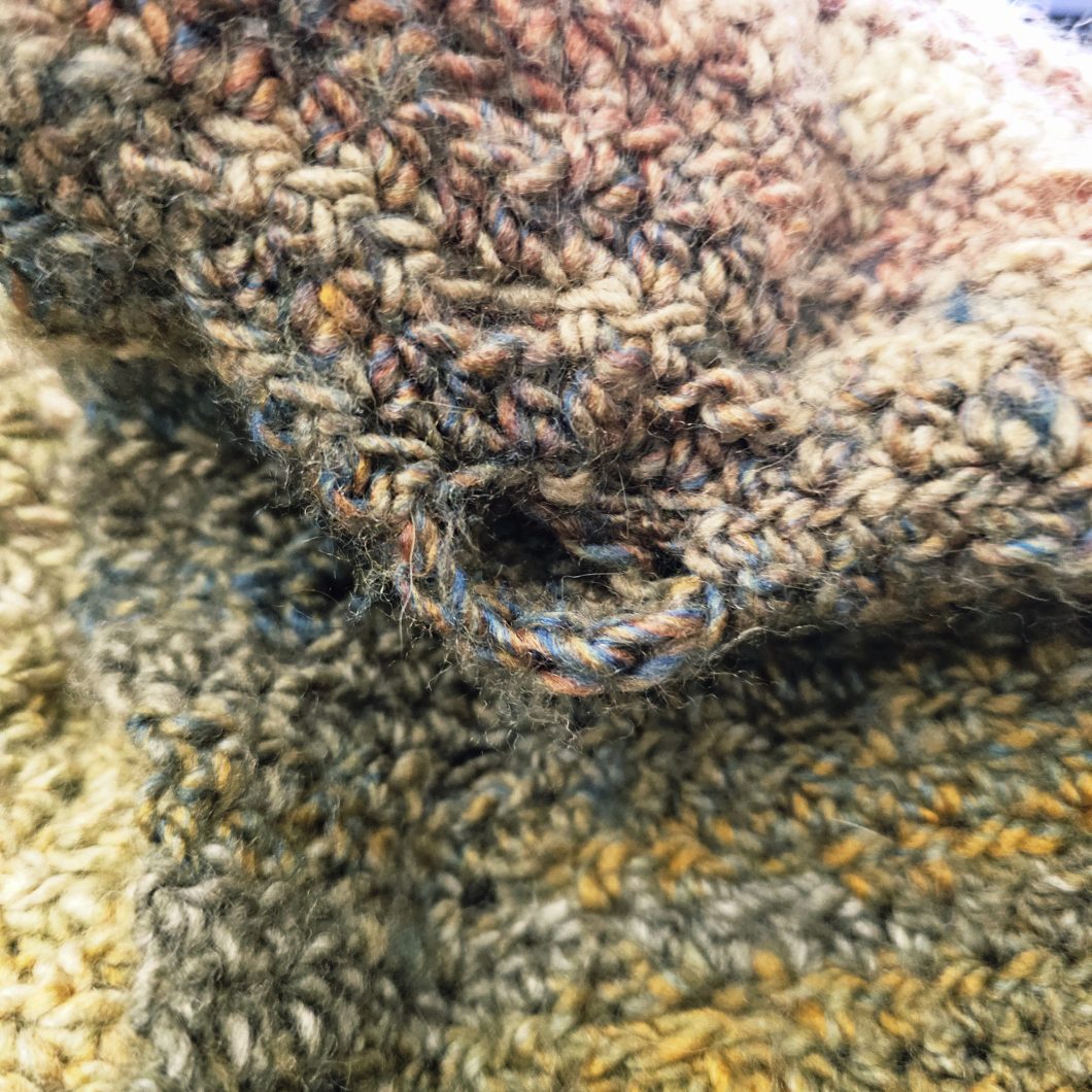 Gap on the wrong side of the scarf created because you skip stitches.